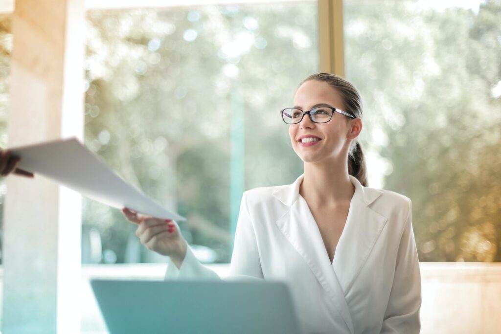 woman receiving papers in office