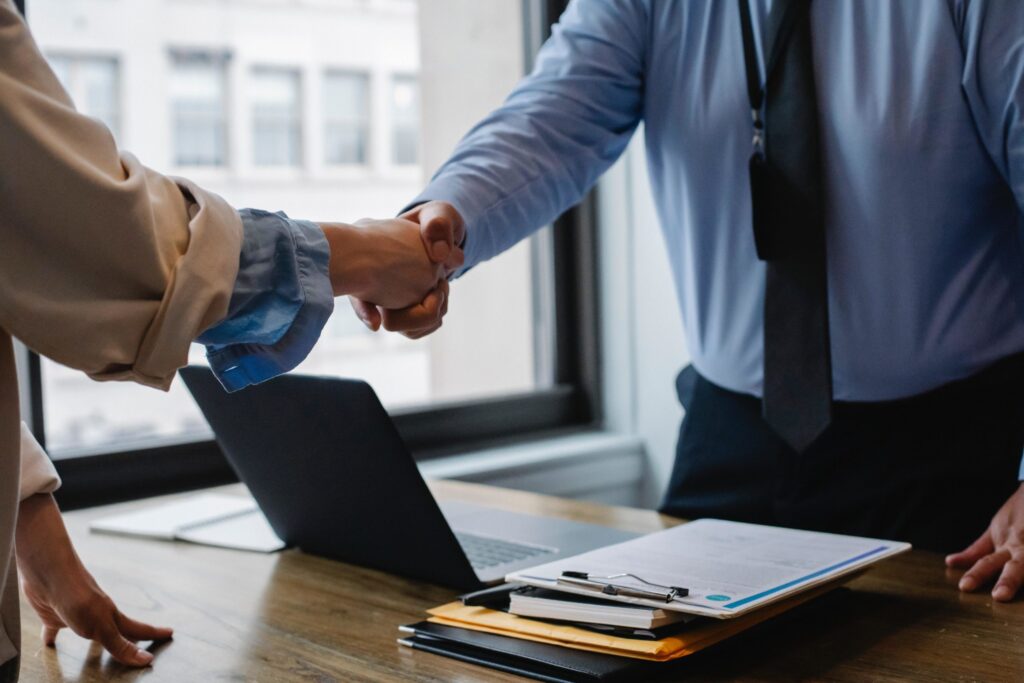 man and woman shaking hands