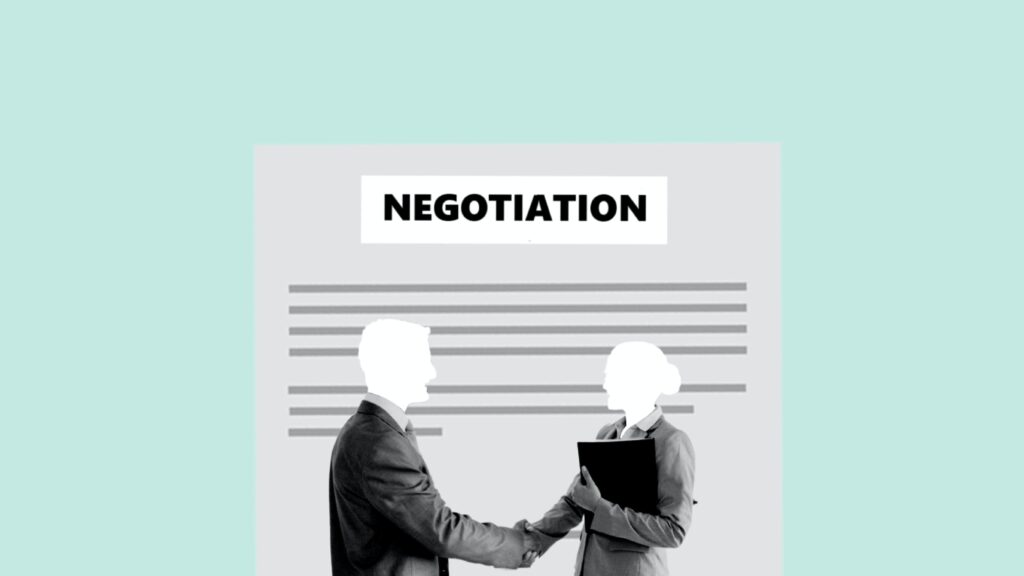 photo of two people shaking hands