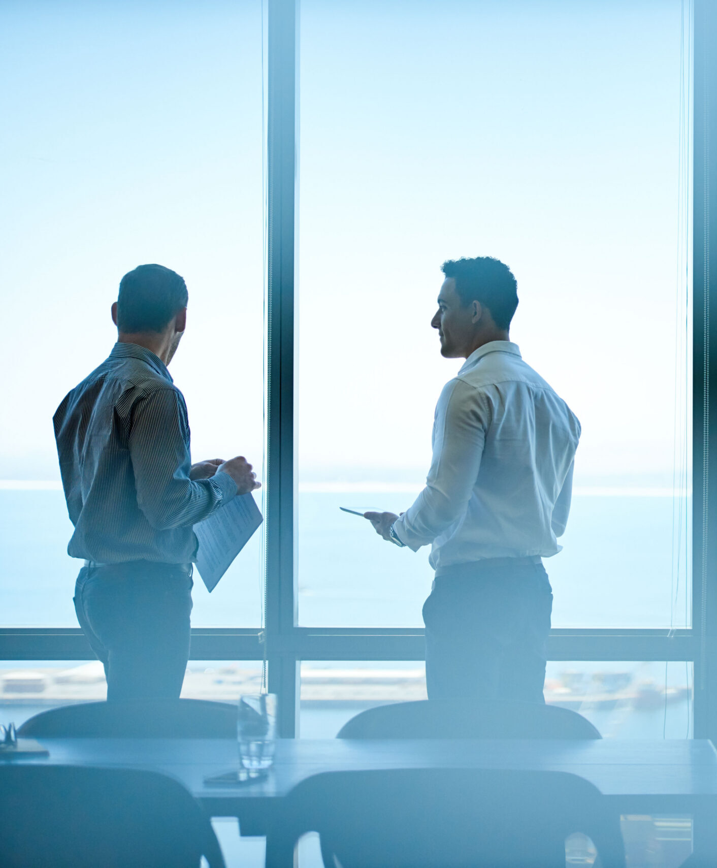 Executives discussing business from high up in an office tower